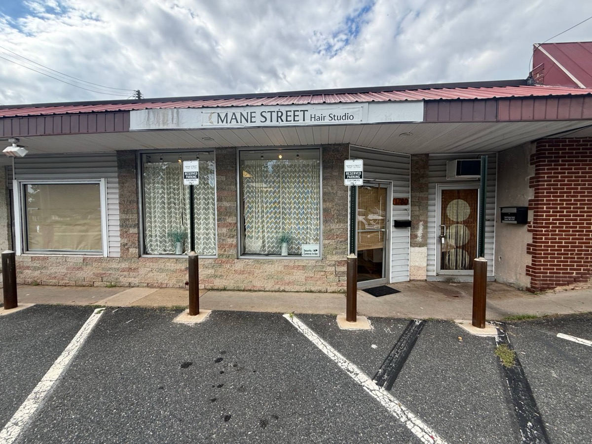 The front door of Mane Street Hair Studio at 1780 Eastern Blvd, Essex, MD, with parking out front